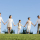 Chinese big family holding hands looking at view in a park